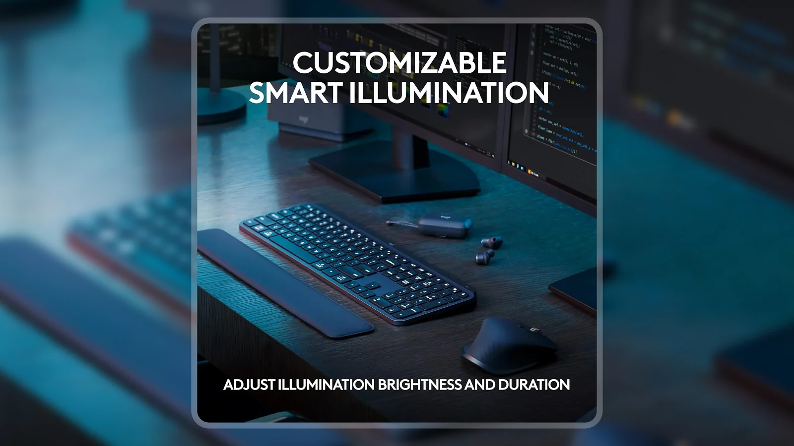Logitech MX Keys S Wireless Keyboard backlit on dark desk with dual monitors and accessories