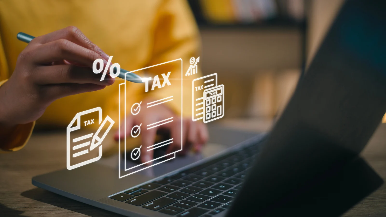 Person working on a laptop with digital overlays of tax forms and a calculator
