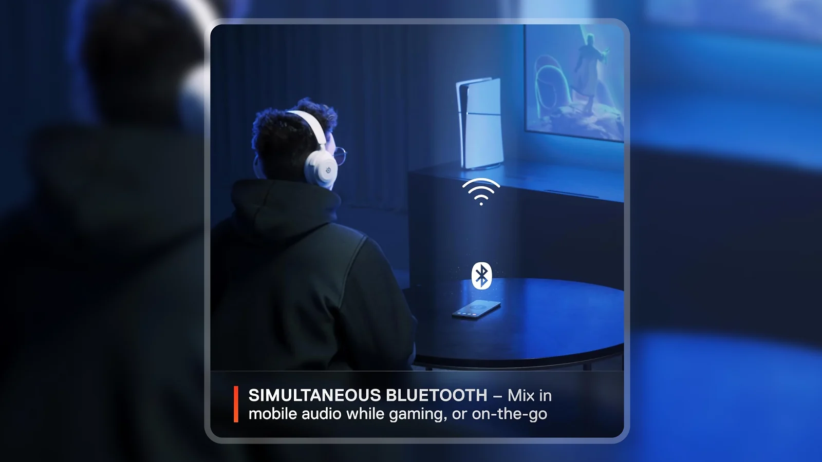Person wearing SteelSeries Arctis Nova 7P Wireless headset gaming in a blue-lit room with PS5 and TV