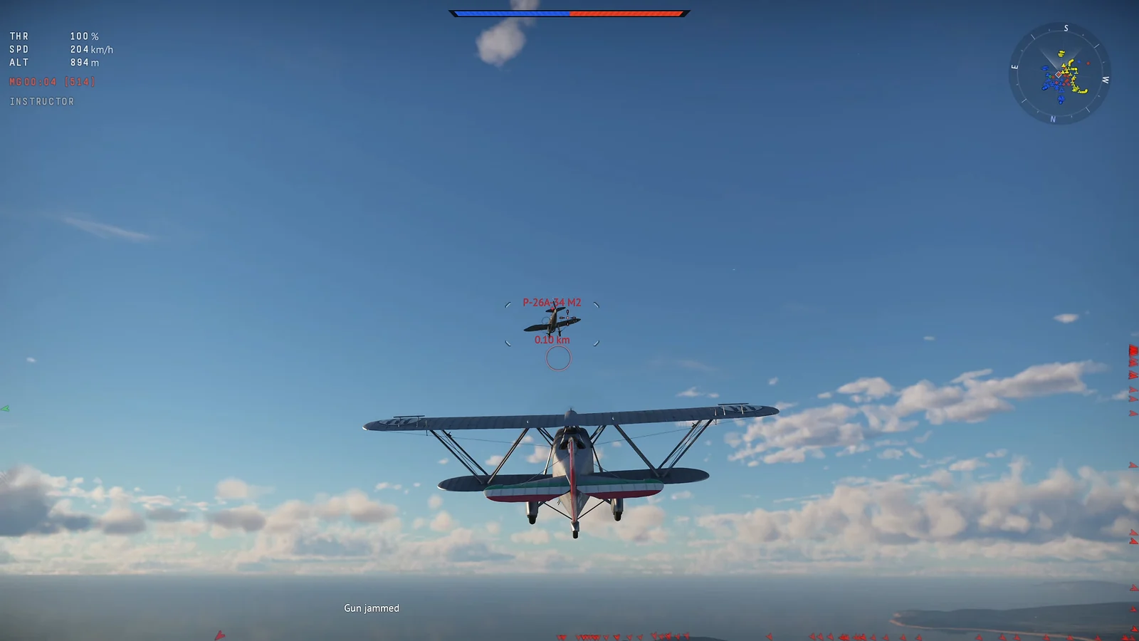 Biplane pursuing an enemy aircraft high above the ocean with jammed guns
