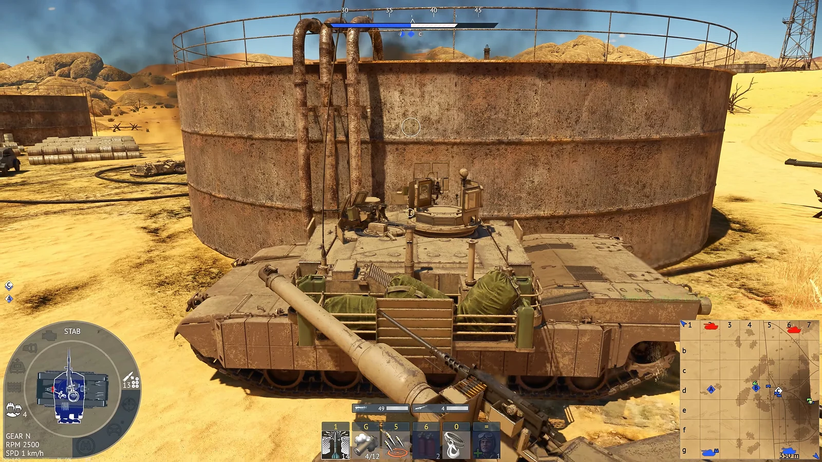 Desert-camouflaged tank positioned beside a large rusty storage tank in an arid map