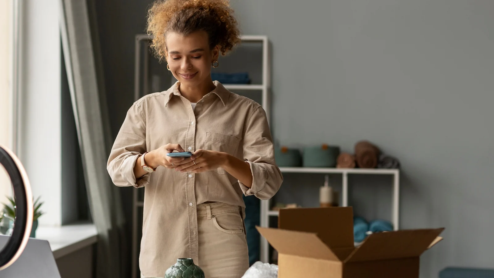 a woman taking photo of items