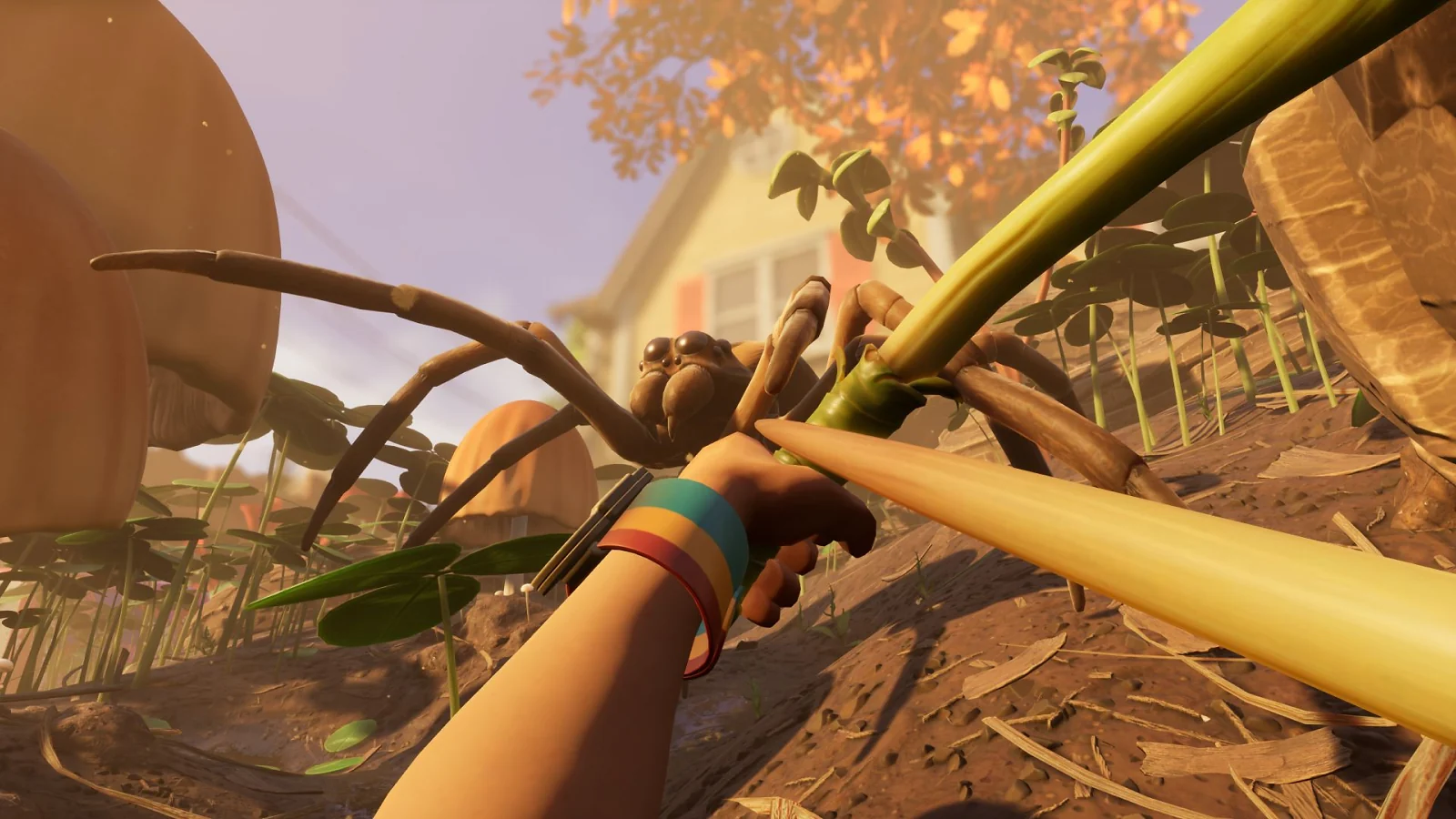 First-person view of a player fighting a giant spider with a spear in Grounded