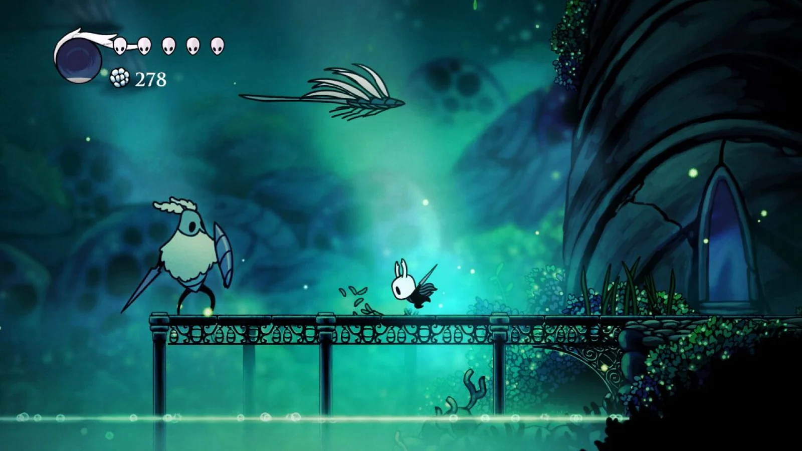 The Knight exploring a glowing underground area in Hollow Knight
