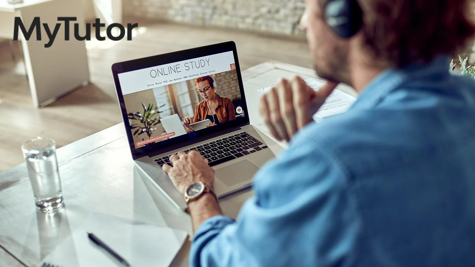 Online tutor running a video lesson on a laptop and MyTutor logo