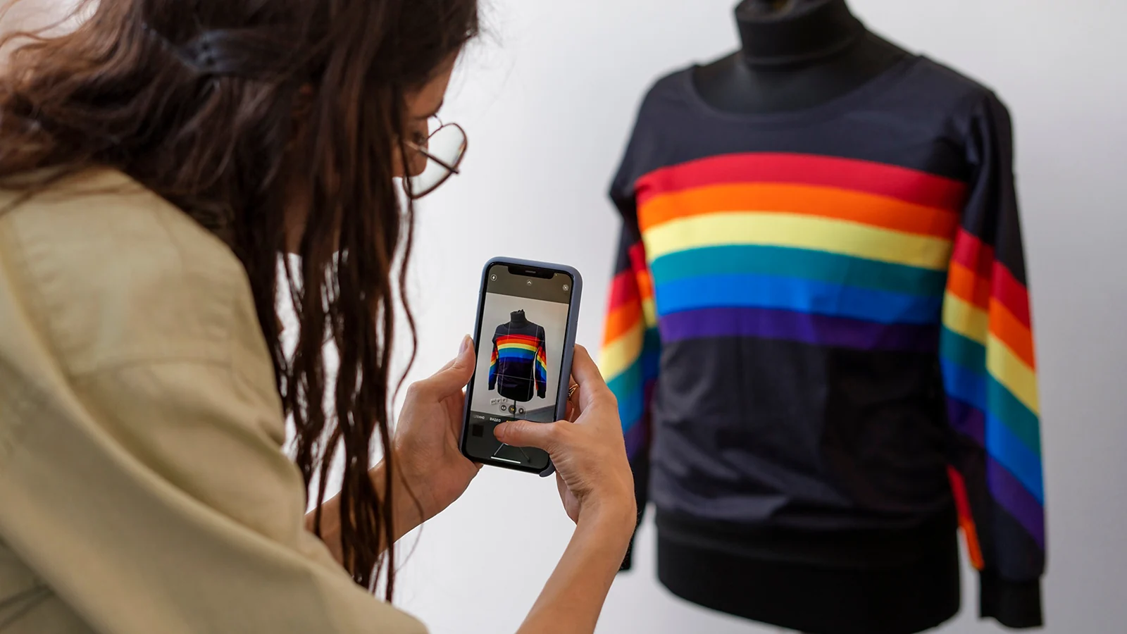 a woman taking a photo of her clothes
