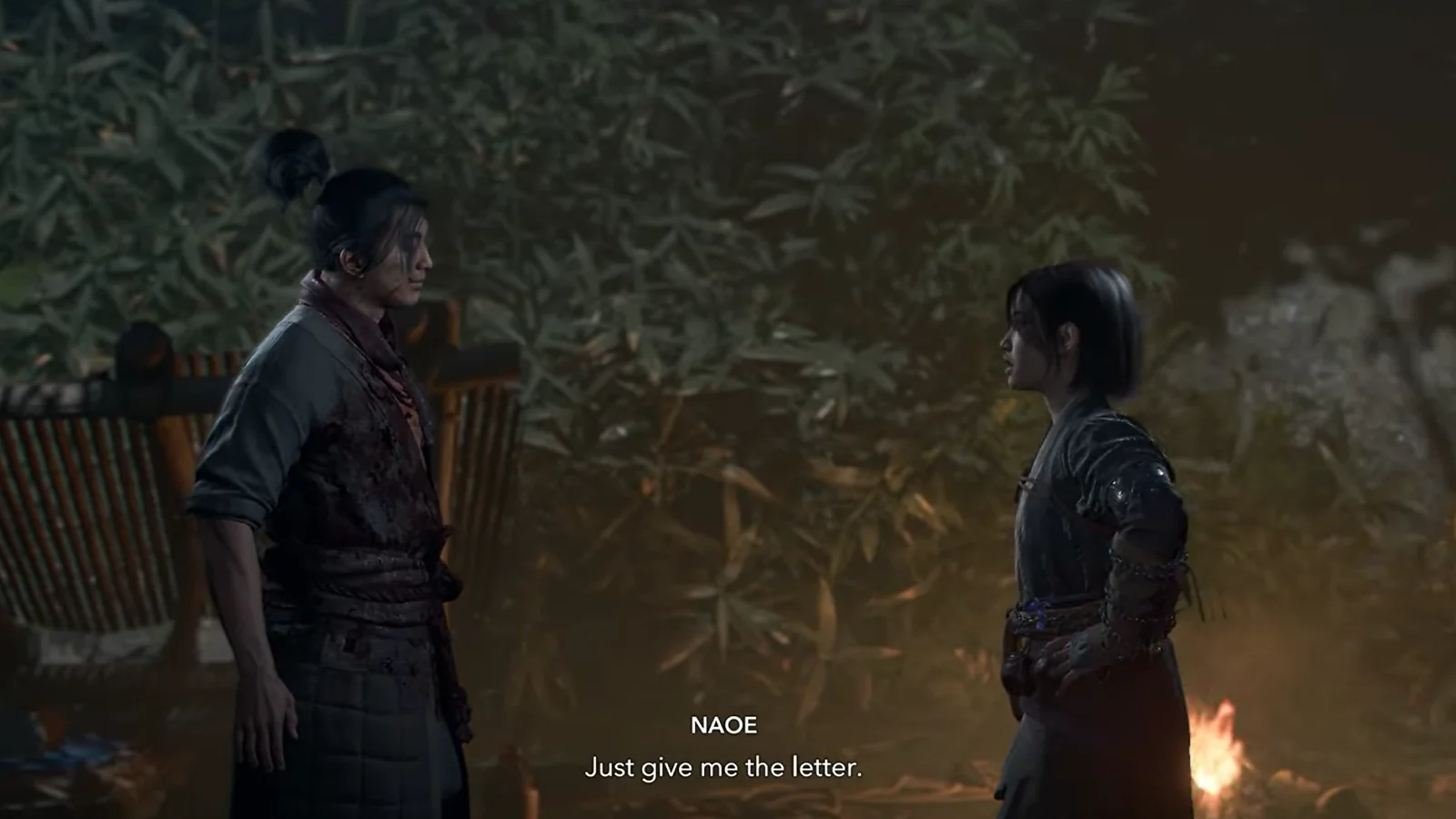 Assassin’s Creed gameplay showing two characters talking in a medieval settlement.