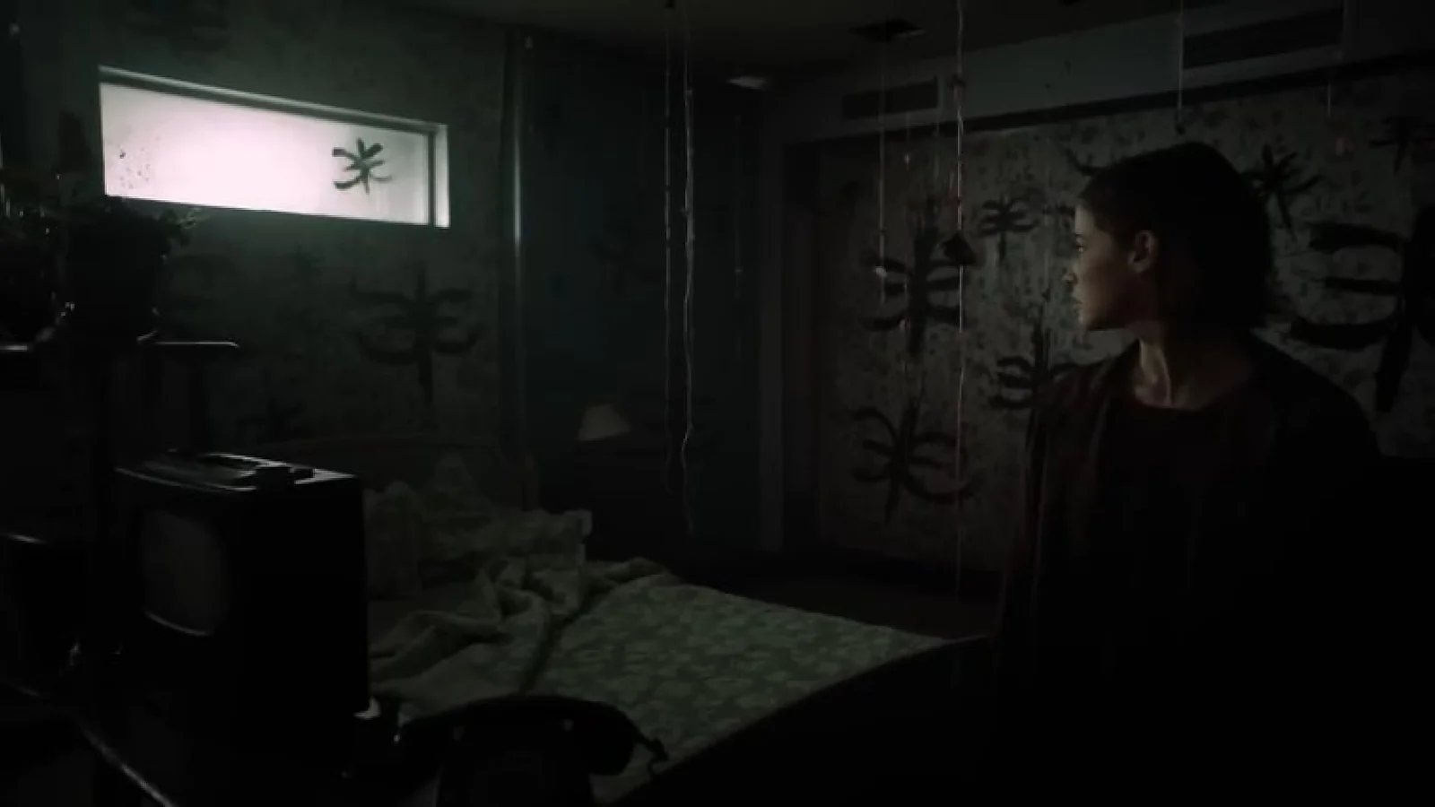 Erica gameplay showing a woman standing inside a dark abandoned room