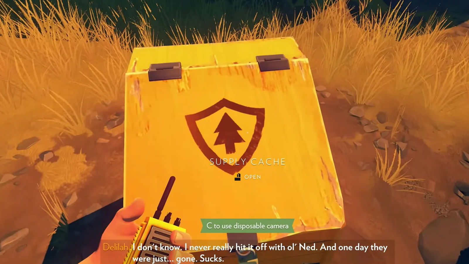 Firewatch gameplay showing a fire lookout map held above a grassy landscape.