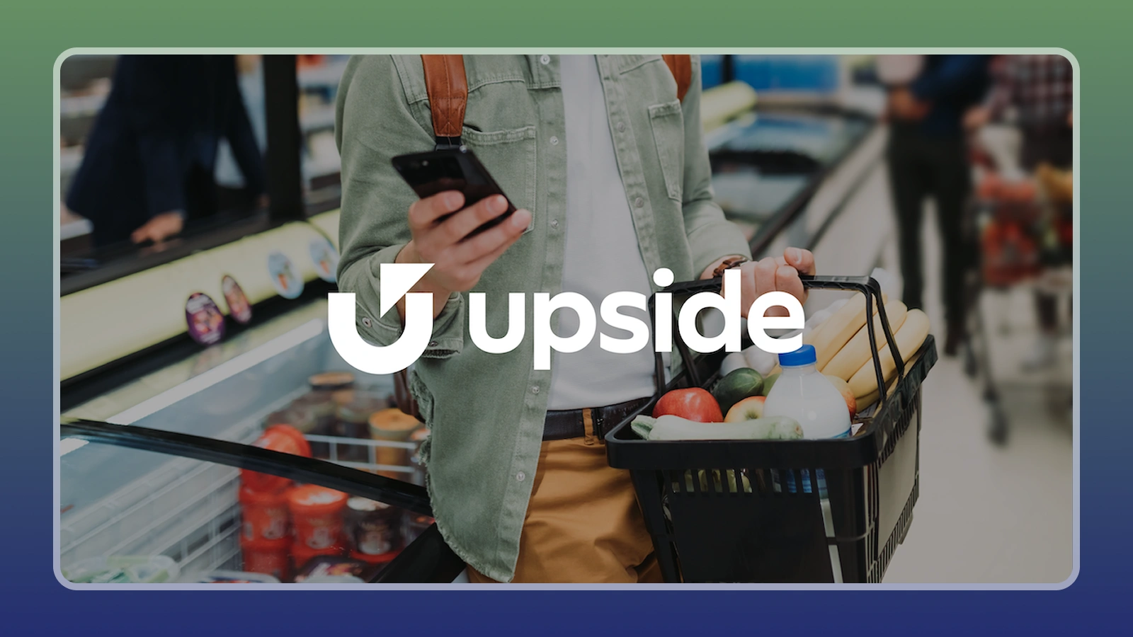 A person holding a bucket with groceries and Upside logo