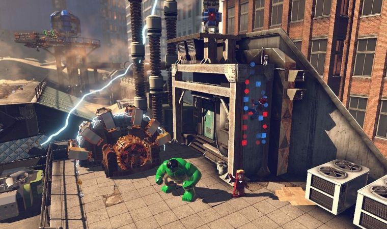 LEGO Marvel Super Heroes gameplay showing Hulk and other heroes fighting on a city rooftop.