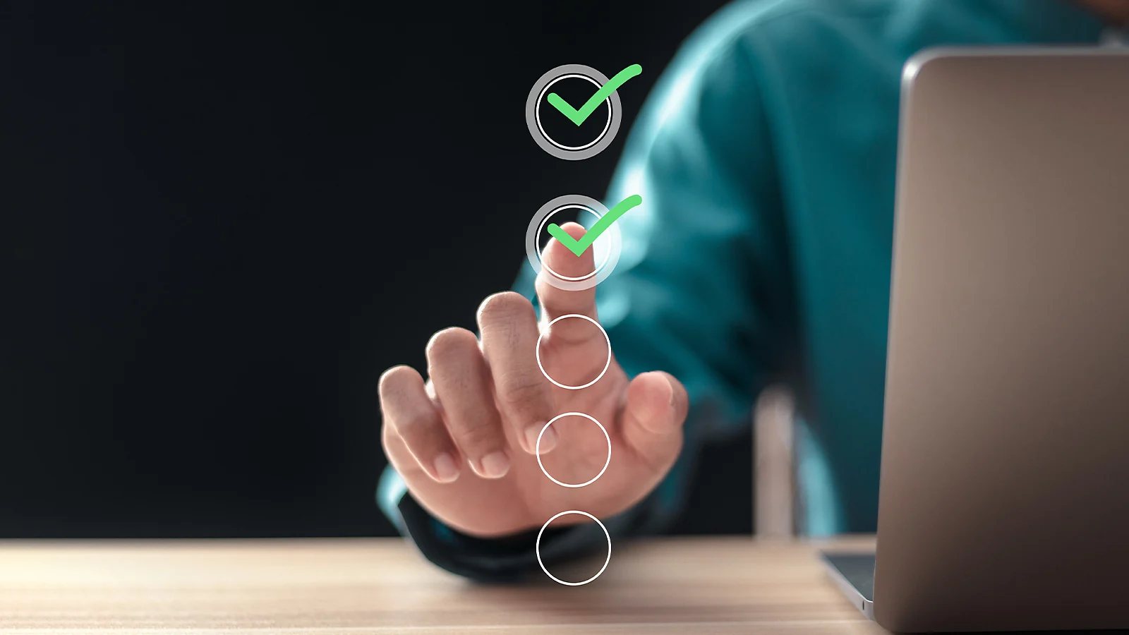 Person pointing to a digital checklist of selection criteria for profitable side hustles next to a laptop