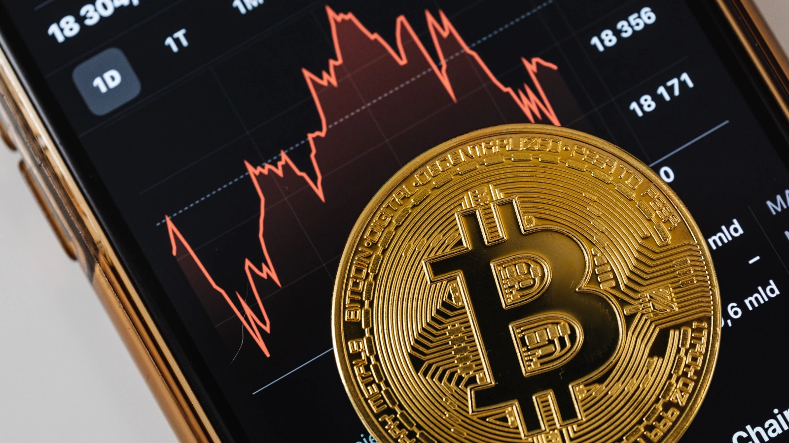 Crypto token on a phone showing market trends