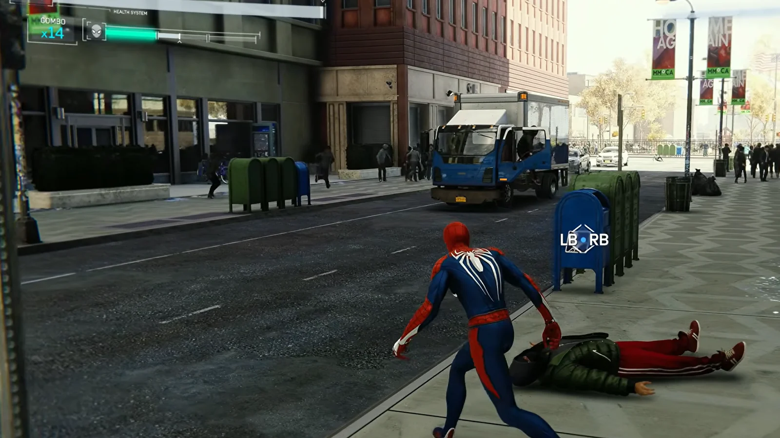Marvel’s Spider-Man Remastered gameplay showing Spider-Man approaching a fallen enemy on a city street.