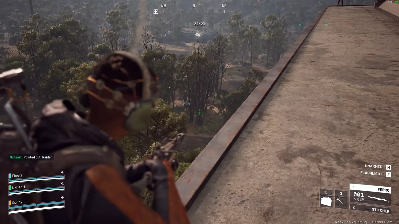 A Raider holding a rifle on a rooftop overlooking a wooded landscape