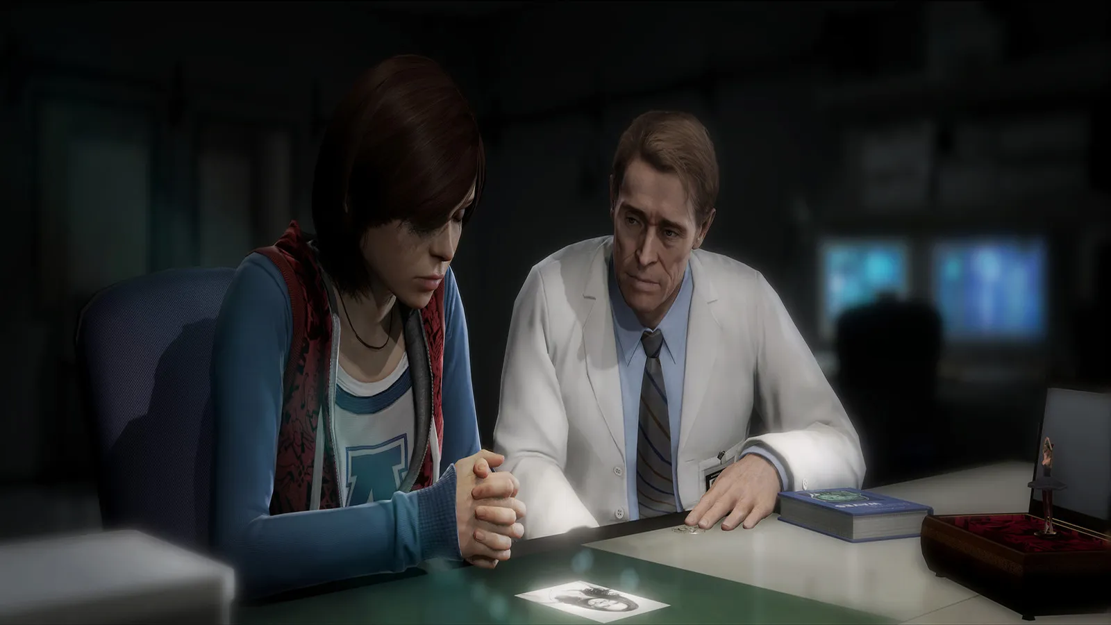 Beyond: Two Souls sitting with doctor reviewing photo