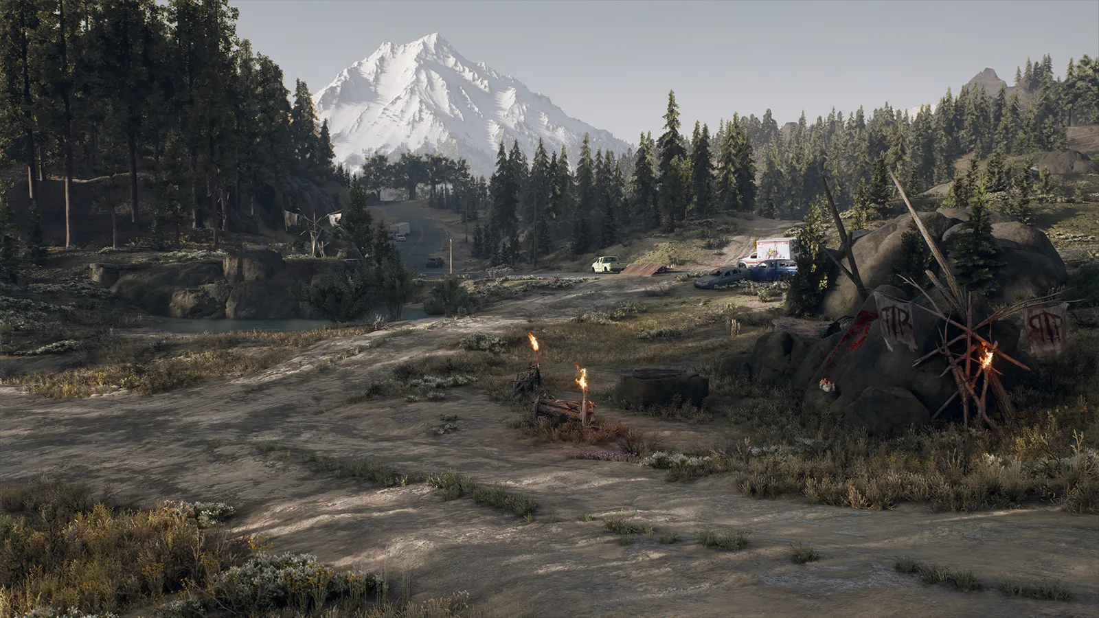 Days Gone scenic overlook of snowy peak and survivor camp
