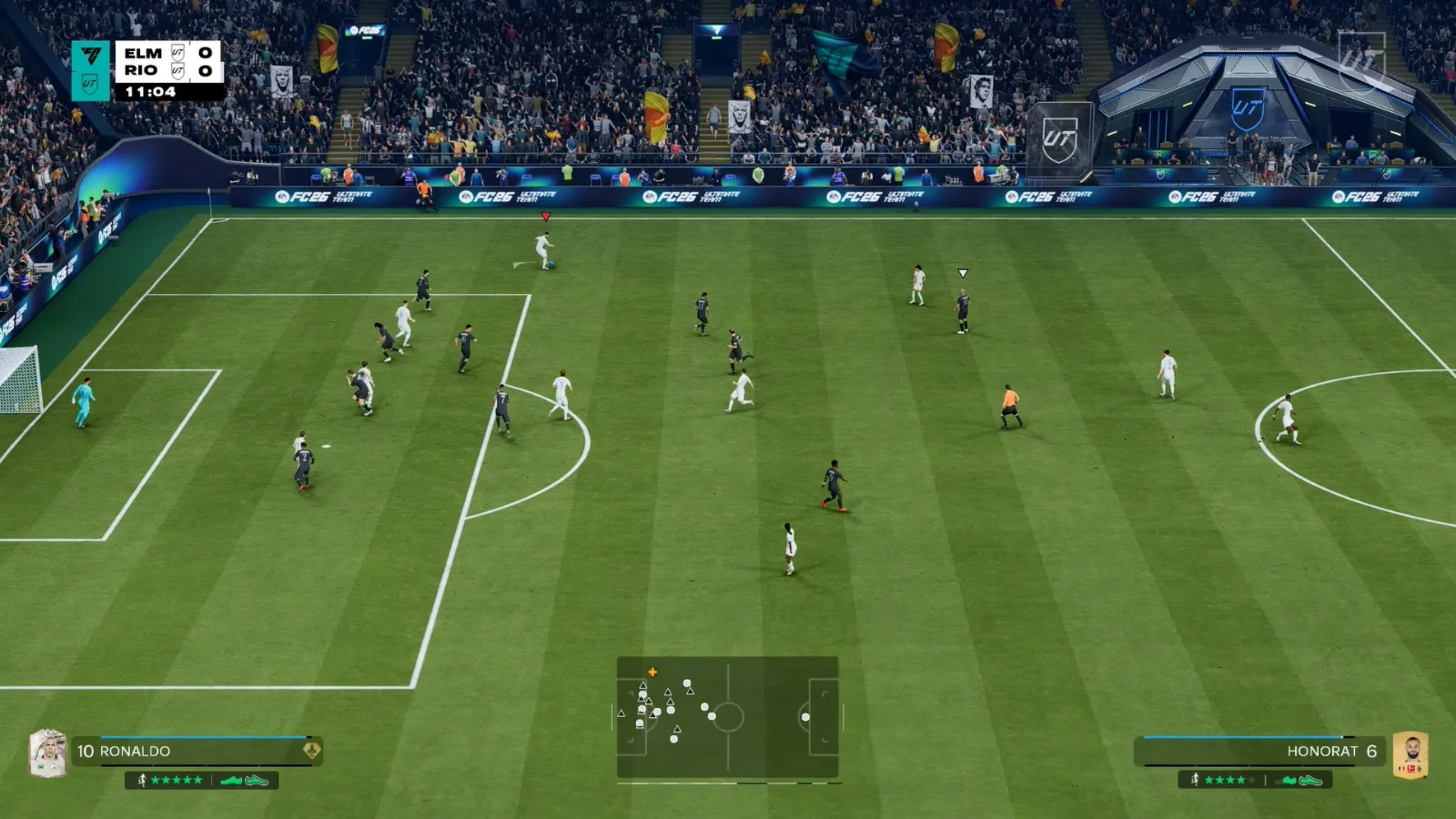 A football match in progress in a packed stadium with player score indicators and a mini-map at the bottom.
