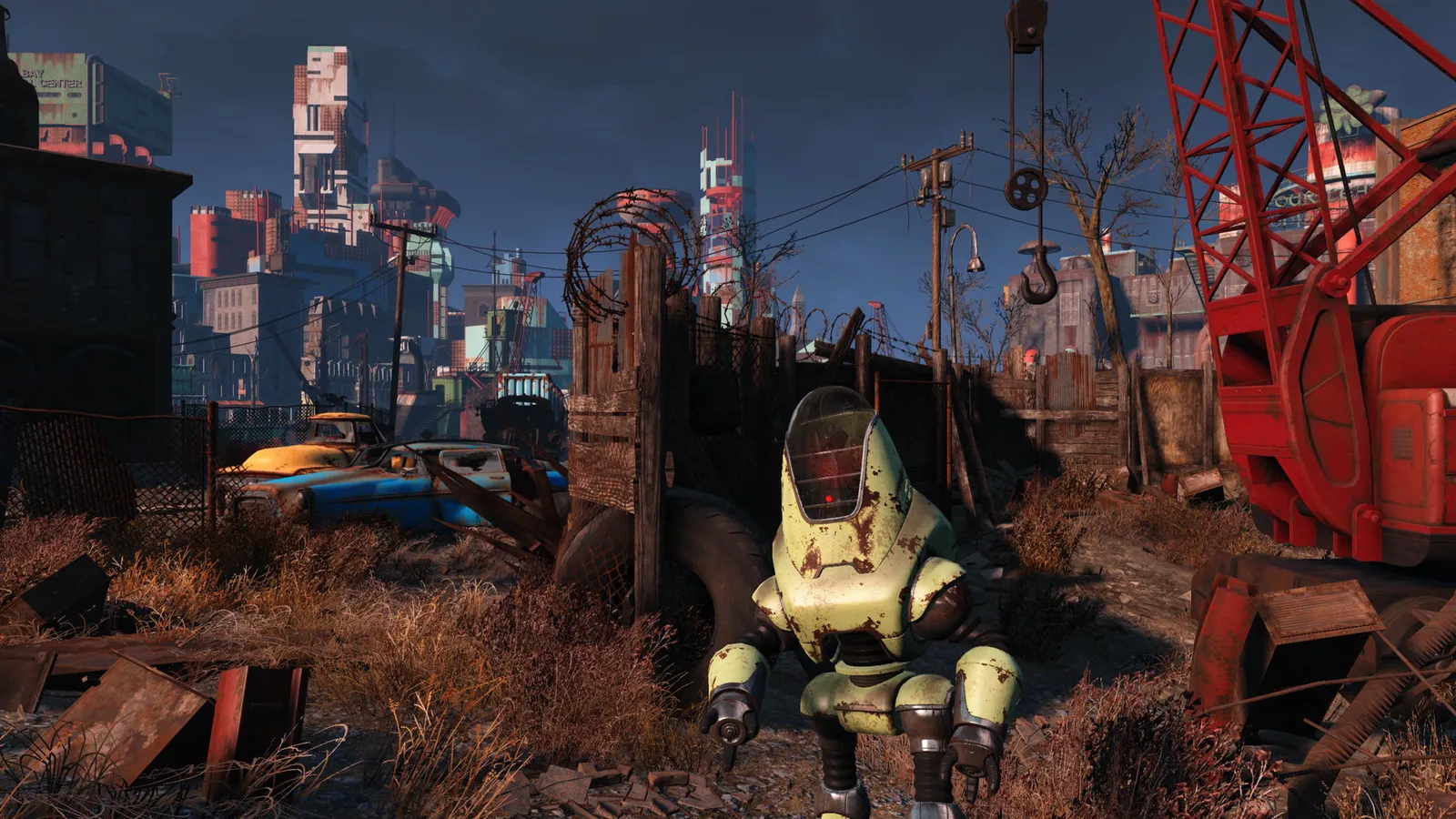 Fallout 4 (GOTY) protectron robot approaching in junkyard at dusk