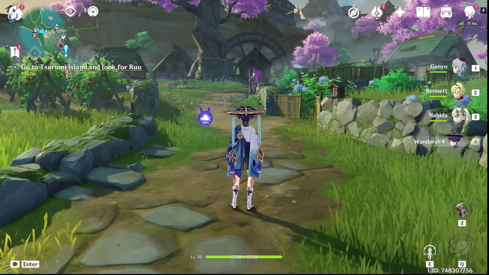 Wanderer standing on a grassy path surrounded by trees, rocks, and village structures