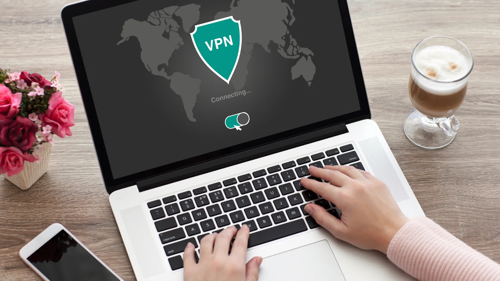 A person connecting to a VPN service on a laptop