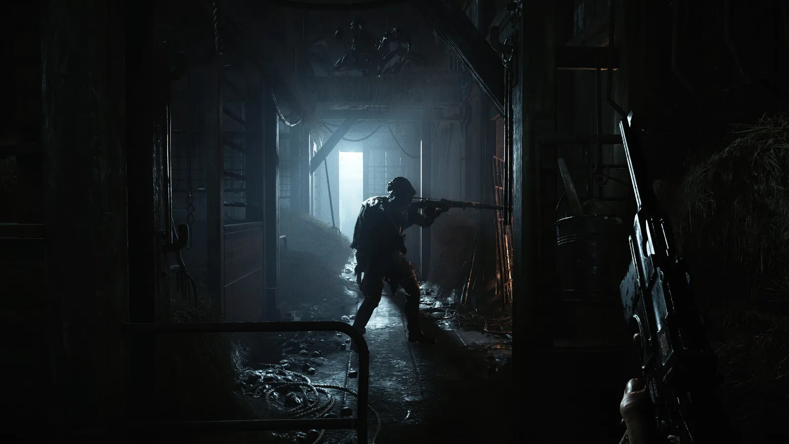 Hunt: Showdown 1896 hunter aims a rifle down a dark barn corridor