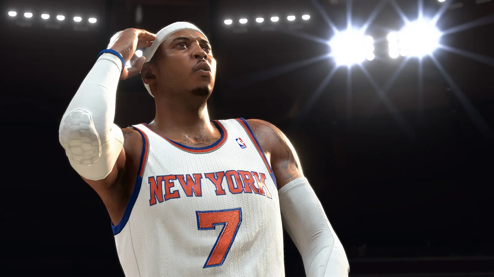 NBA 2K26 knicks player number adjusting headband under arena lights
