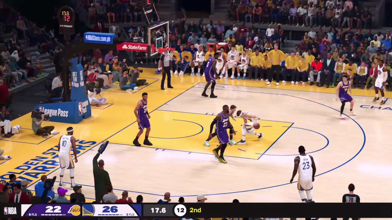 Golden State Warriors players going the basket against the Los Angeles Lakers