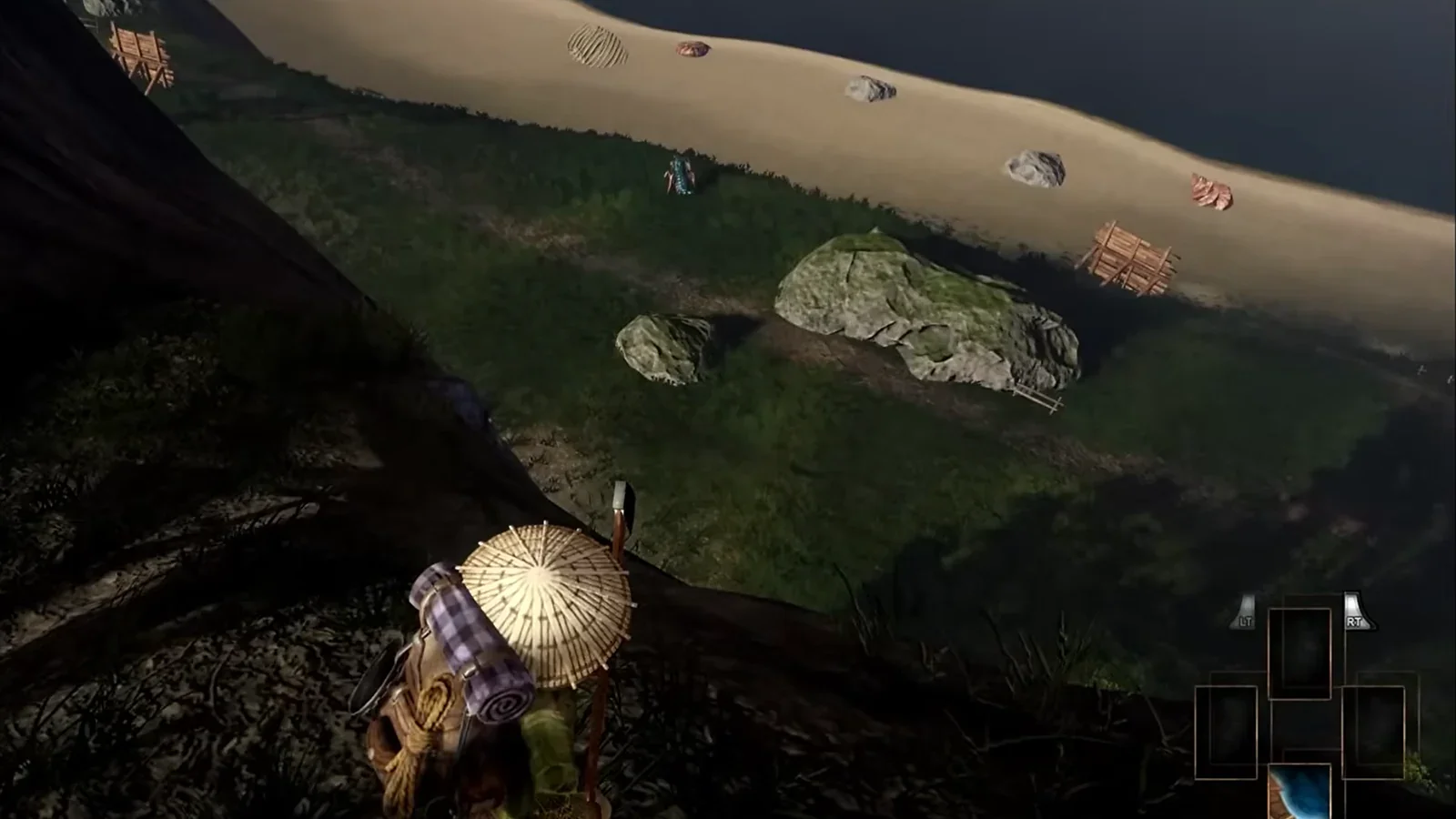 A traveler in a straw hat with a backpack looks down a hill toward a sandy beach