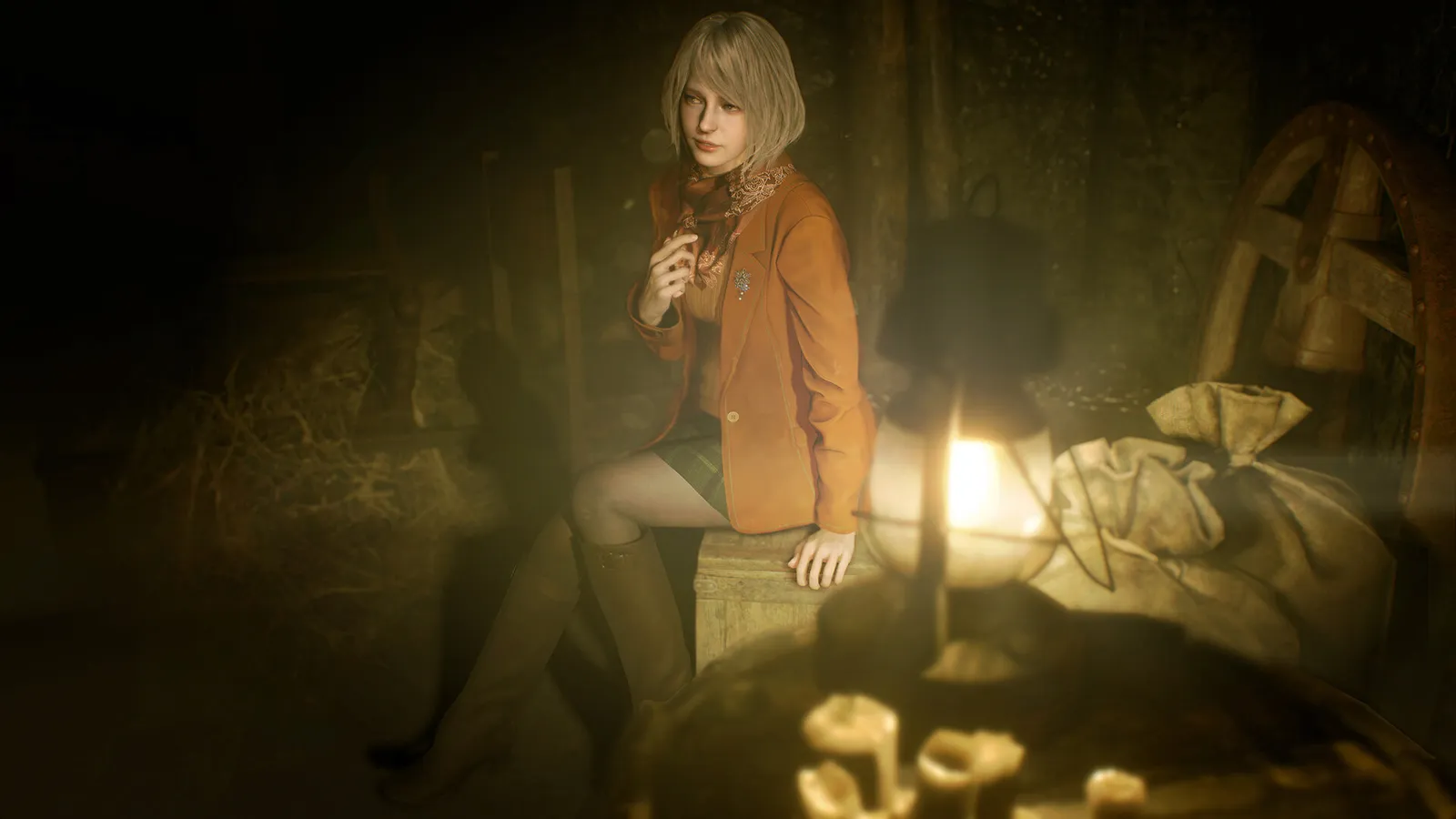Resident Evil 4 ashley sitting in candlelit barn