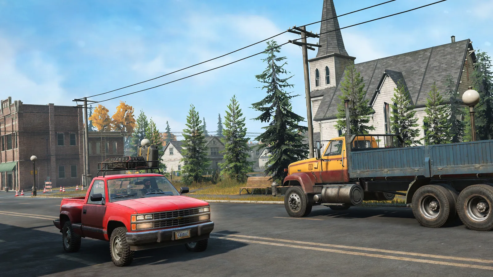 SnowRunner pickup truck and flatbed truck driving through small town